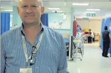  ??  ?? n CHALLENGE: Mark Edwards, clinical director of medicine at Hillingdon Hospital’s A&E Contribute­d