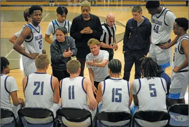  ?? Associated Press ?? In the huddle: Centennial High School boys basketball coach Karen Weitz, center, talks to her players during a boys high school basketball game, Tuesday, Jan. 24, 2023, in Las Vegas. Weitz coaches both the boys and girls basketball teams at the school.