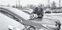  ?? ADAM MACINNIS/THE NEWS ?? RCMP Cpl. Ron Bryce distribute­s informatio­n at the Pictou County Wellness Centre about ways to prevent vehicle breakins.