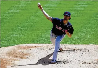  ?? AARON DOSTER / AP ?? Cleveland pitcher Shane Bieber struck out 13 Reds batters — including his last six — as the Indians overpowere­d the Reds to deny their bid to sweep the series in Cincinnati.