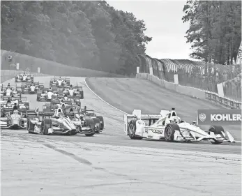  ?? MIKE DINOVO, USA TODAY SPORTS ?? Simon Pagenaud, right, finished fourth in the Kohler Grand Prix at Road America.