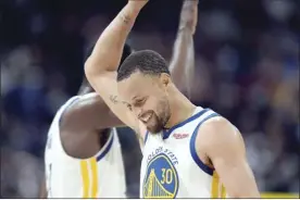  ?? AP photo ?? The Warriors’ Stephen Curry celebrates with Draymond Green near the end of Golden State’s playoff win over Denver on Thursday.