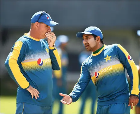  ??  ?? Pakistan captain Sarfraz Ahmed and coach Mickey Arthur have reported an illegal approach to the world body ICC AFP