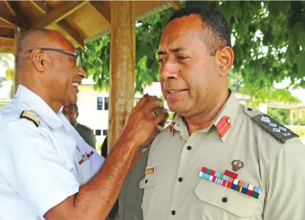 ?? Photo: RFMF Media Cell ?? RFMF Commander Rear Admiral Viliame Naupoto badging Brigadier-General Ro Jone Kalouniwai on January 17, 2018.