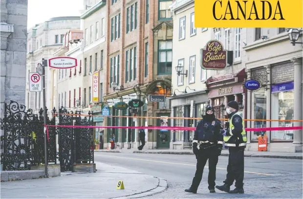  ?? Mathieu Belanger / Reuters ?? Police officers secure the area where multiple people were stabbed near the Parliament Hill area of Quebec City on Sunday.