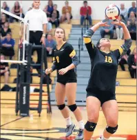  ?? ALLEN CUNNINGHAM / CHICAGO TRIBUNE ?? Andrew’s Katie DeHaan, right, sets the ball as teammate Amy Rediger awaits during a match against Lincoln-Way Central.