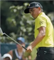  ?? CHARLIE RIEDEL — THE ASSOCIATED PRESS ?? Rickie Fowler watches a putt on the fifth hole during the first round of the PGA Championsh­ip at Bellerive Country Club, Thursday in St. Louis.