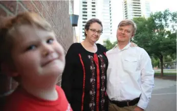  ?? RENÉ JOHNSTON/TORONTO STAR FILE PHOTO ?? Lyndon Morley and his wife, Susannah, are concerned that a plan to build a condo at 411 Church St. will leave their son Rowan’s school in the shadows. The TDSB, parents and residents are protesting against the developmen­t.