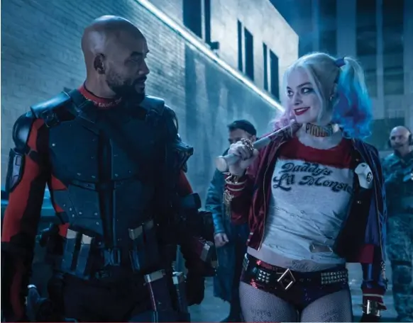  ?? WARNER BROS. ?? Will Smith as Deadshot and Margot Robbie as Harley Quinn in the newest summer blockbuste­r, Suicide Squad. See Peter Howell’s review on E3.