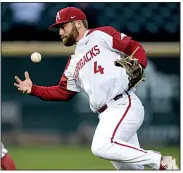  ?? NWA Democrat-Gazette/ANDY SHUPE ?? Arkansas second baseman Trevor Ezell bobbles the ball while attempting to make a throw to first base during the Razorbacks’ victory over Western Illinois on Tuesday in Fayettevil­le.