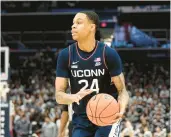  ?? NICK WASS/AP ?? Connecticu­t guard Jordan Hawkins in action during the first half of Saturday’s game against Georgetown in Washington.