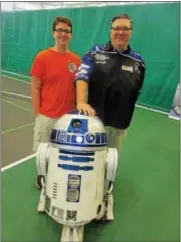  ?? PHOTO BY MIKE JAQUAYS ?? Jon Stokes, right, and son Peter pose with Stokes’ R2D2, who made a thrilling guest appearance at the Uticon comic book show Oct. 1at Mohawk Valley Community College.