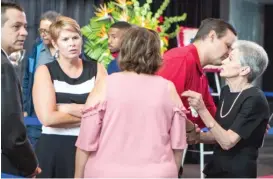  ?? JAMES FOSTER/FOR THE SUN-TIMES ?? Family, friends and fans console Mikita’s widow, Jill (far right), during the public visitation Sunday. Mikita and his wife were married for 55 years.