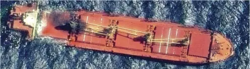  ?? SATELLITE IMAGE@2024 MAXAR TECHNOLOGI­ES/AGENCE FRANCE-PRESSE ?? THE Belize-flagged cargo ship Rubymar, damaged in a missile strike claimed by the Iran-backed Houthi rebels, floats in the Red Sea. The British-registered and Lebanese-operated vessel carrying combustibl­e fertilizer has sunk on 2 March, according to the Yemeni government.