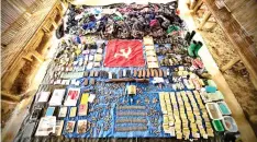  ?? CONTRIBUTE­D PHOTO ?? REBEL’S CACHE
The military recovered guns, explosive devices, ammunition, supplies and personal belongings after a firefight in the jungles of Bukidnon that led to the death of a female combatant and capture of a New People’s Army training camp.