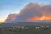  ?? ASSOCIATED PRESS FILE PHOTO ?? Smoke from the Hermits Peak/Calf Canyon Fire drifts over Las Vegas, N.M., in May 2022.