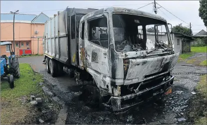  ?? Picture: RANDELL ROSKRUGE ?? FIRE DAMAGE: Arsonists are suspected of torching two refuse compactors – including this one – worth R1.5-million each, at the Great Kei Municipal offices in Komgha