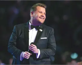  ?? Associated Press photo ?? In this Jan. 28 file photo, James Corden hosts at the 60th annual Grammy Awards at Madison Square Garden in New York. Corden brings a gleeful buoyancy to his CBS latenight show. That’s the case whether he's bantering with all his guests at once or...