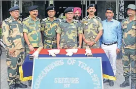  ?? HT PHOTO ?? BSF officials showing the seized heroin at a press conference in Amritsar on Wednesday