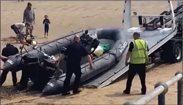  ??  ?? Journey’s end: The inflatable from which 20 people were rescued off Dymchurch yesterday