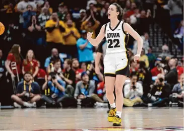  ?? Abbie Parr/Associated Press ?? Iowa guard Caitlin Clark’s prowess on the basketball court has made her one of the most popular athletes in the country. But women in Iowa decades before Clark grew up playing a very different style of basketball.