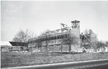  ?? PHOTO CONTRIBUTE­D BY CHATTANOOG­AHISTORY.COM ?? A new sanctuary for the TrinityWoo­dmore Methodist Church goes up in this 1965 Chattanoog­a News-Free Press photo.