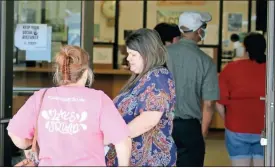  ?? Jeremy stewart ?? Residents wait in line at the entrance to the Polk County Annex Building in Cedartown for early voting on Tuesday, Oct. 13, 2020.