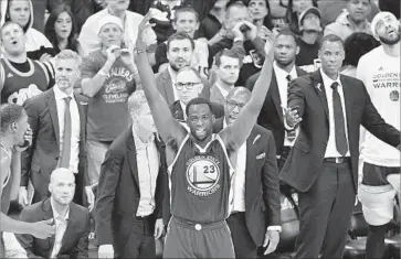  ?? Jason Miller Getty Images ?? “BRING IT ON,” Golden State’s Draymond Green seemed to be saying Friday night as he gestured toward fans at Quicken Loans Arena in Cleveland after being called for a foul during Game 4 of the NBA Finals.