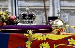  ?? PHOTO: GETTY IMAGES ?? The coffin of Queen Elizabeth II with the Imperial State Crown, orb and sceptre resting on top is carried into the abbey.