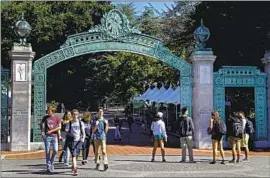  ?? Ben Margot Associated Press ?? SATHER GATE at UC Berkeley. UC scholars are sharing research on decarboniz­ation and the electrific­ation of transporta­tion with peers in Berlin and Brussels.