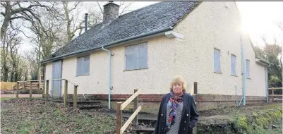  ??  ?? ■ Charnwood Borough councillor, Coun Hilary Fryer, chair of Outwoods Management Committee in front of the Ranger’s Cottage at the Outwoods.