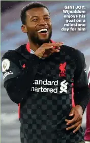  ??  ?? GINI JOY: Wijnaldum enjoys his goal on a milestone day for him