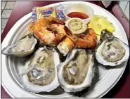  ?? Special to the Democrat-Gazette/MARCIA SCHNEDLER ?? Oysters and shrimp are flavorful at Oaklawn’s Oyster Bar, one of the varied food venues at the venerable Hot Springs racetrack.