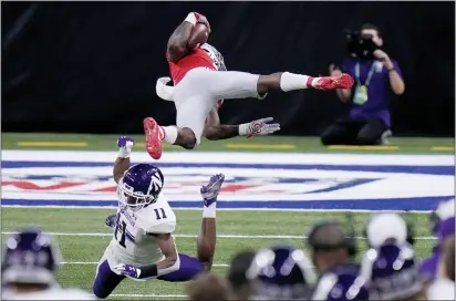  ?? AJ MAST — THE ASSOCIATED PRESS ?? Ohio State running back Trey Sermon, top, is sent flying by Northweste­rn defensive back A.J. Hampton (11) during the Big Ten championsh­ip.