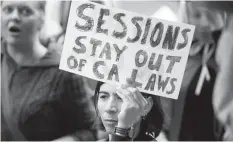  ?? AGENCE FRANCE PRESSE ?? People protest outside a speech by US Attorney General Jeff Sessions, in Sacramento, California; the progressiv­e state is battling the Trump administra­tion over its immigratio­n crackdown.