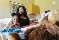  ?? Jon Shapley / Houston Chronicle file ?? Courissa Clark essentiall­y lived in a rehabilita­tion hospital for three month last year, providing care for her daughter Nevaeh Hall, who suffered brain damage during a dental procedure.