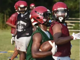  ?? (Pine Bluff Commercial/I.C. Murrell) ?? Dollarway High School football players endure the grind of a preseason camp practice earlier this month. The team will begin their season against Helena-West Helena Central tonight.