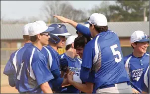  ?? The Sentinel-Record/Rebekah Hedges ?? ROUND TRIP: The Jessievill­e Lions celebrate after Adam Saveall’s solo home run against Haskell Harmony Grove Saturday in the Magnet Cove spring break tournament championsh­ip. Saveall had two hits and two RBIs in Jessievill­e’s 10-6 win.