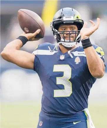  ?? STEPHEN BRASHEAR/AP ?? Star quarterbac­k Russell Wilson returns to the Seahawks after a bumpy offseason.