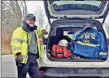  ?? Washington Ambulance Associatio­n / Contribute­d photo ?? Jorge Criolo with his vehicle at a race standby. Members carry a jumpkit with medical supplies such as assessment needs, oxygen, airway items, tourniquet and bandages for bleed control, splinting materials, as well as an AED for patients in cardiac arrest.