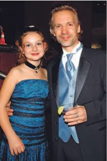  ?? TANNIS TOOHEY/TORONTO STAR ?? Michael Riley chums around with daughter Dylan yesterday at the Azure Restaurant’s cocktail party in Yorkville before the Geminis. The party would only get bigger for Riley, who won the award for best actor in a drama series for This is Wonderland.