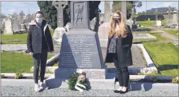  ??  ?? Sinn Féin members Róisín Hannan (left) and Kate O’Connell laying a wreath at Liam Lynch’s grave in Kilcrumper old Cemetery, Fermoy.