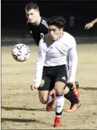  ?? Jeremy Stewart / RN-T ?? Pepperell’s Ramiro Alanis (front) zeroes in on the ball in front of Coosa’s Chandler Hubbard during the first half of a Region 7-AA soccer match Friday at Pepperell High School.