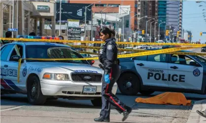  ??  ?? The scene in Toronto after a van drove along a sidewalk striking pedestrian­s. Photograph: Warren Toda/EPA