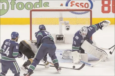  ?? The Canadian Press ?? Vancouver Canucks goalie Jacob Markstrom stops a Vegas Golden Knights shot during second-period NHL playoff action in Edmonton on Sunday night.