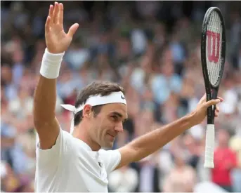  ?? (Photo by Gareth Fuller, AP pool photo) ?? Roger Federer celebrates after beating Tomas Berdych in the men's singles semifinal match at Wimbledon on Friday.