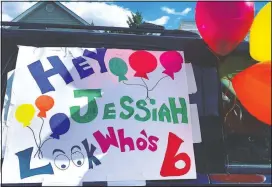  ?? (Courtesy Photo/Ashley Johnson) ?? A birthday sign and a cluster of balloons hang on a car window ready for Jessiah’s birthday parade.