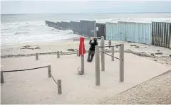  ?? REUTERS ?? A person exercises in front of a section of a US-Mexico border wall in Tijuana, Mexico on May 21.