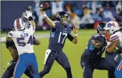  ?? WADE PAYNE — THE ASSOCIATED PRESS ?? Tennessee Titans quarterbac­k Ryan Tannehill led his team to 42-16 rout of the Buffalo Bills on Tuesday.