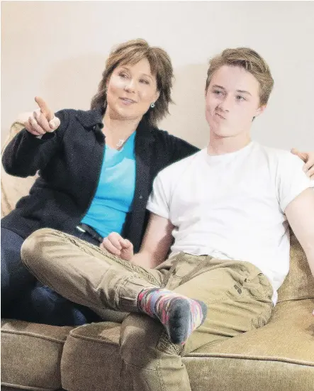  ?? — THE CANADIAN PRESS ?? B.C. Liberal Leader Christy Clark and her son Hamish watch the polls Tuesday.